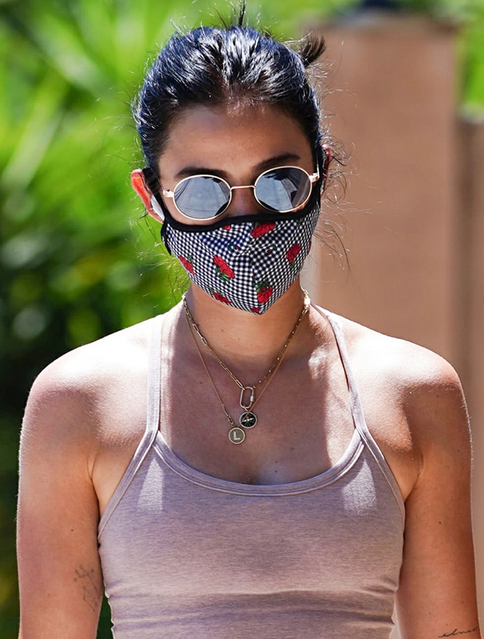 Lucy Hale wears Ray-Ban sunnies with Masqd checkered face mask