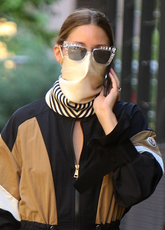 Olivia Palermo styles her look with Jimmy Choo bedazzled sunglasses and Le Scarf scarf