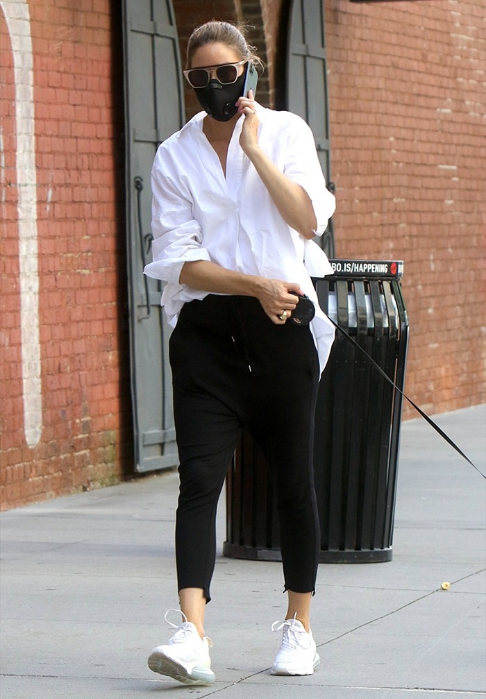 Olivia Palermo keeps it casual with an oversized white shirt and black joggers