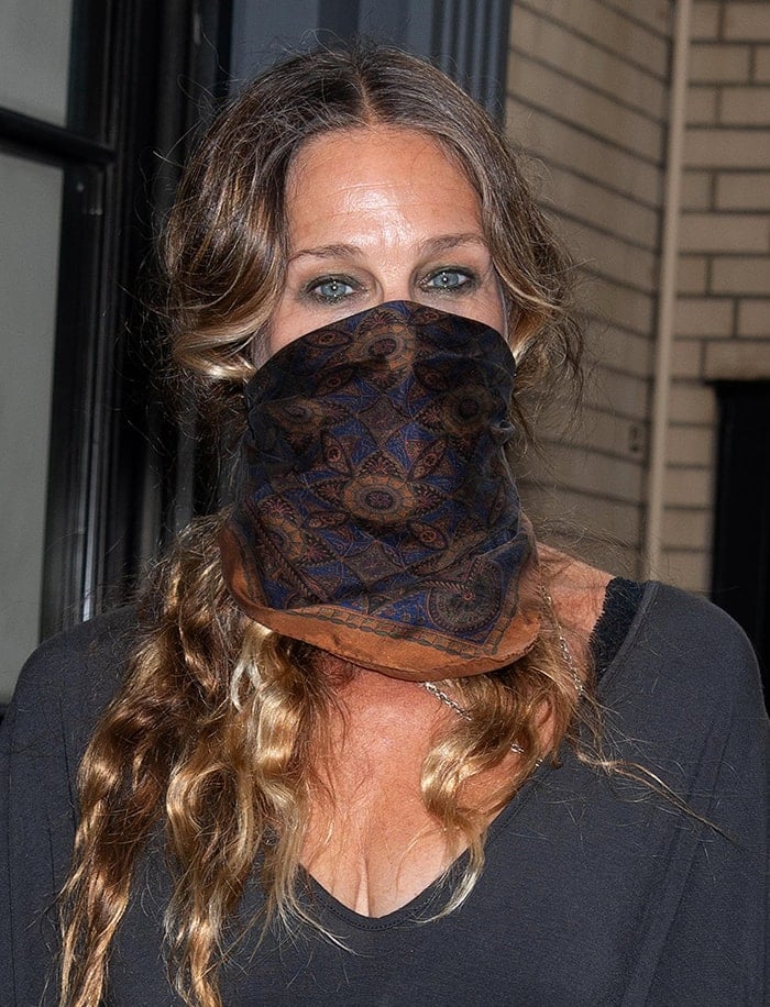 Sarah Jessica Parker wears a printed scarf as a face covering