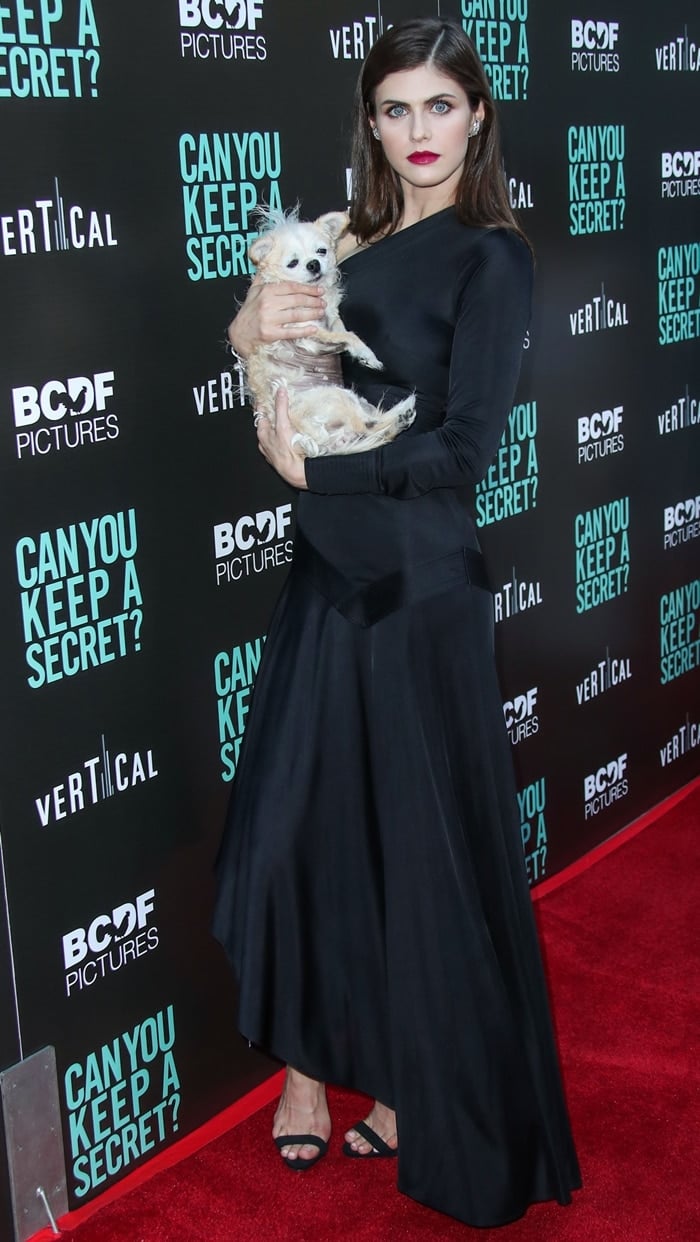 Actress Alexandra Daddario wore a black maxi dress from the mother and daughter design team behind Alexis at the Los Angeles Premiere Of Vertical Entertainment's 'Can You Keep A Secret?'