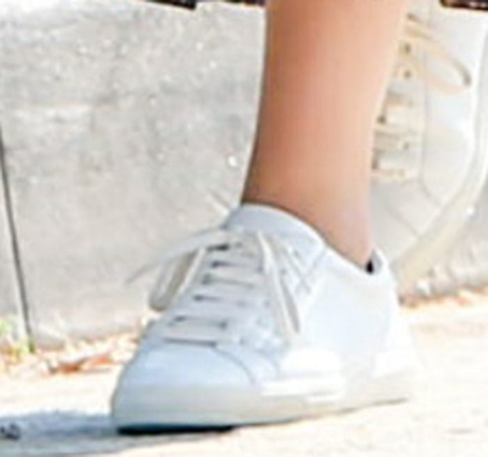 Ana de Armas completes her dog-walking look with Saint Laurent white sneakers