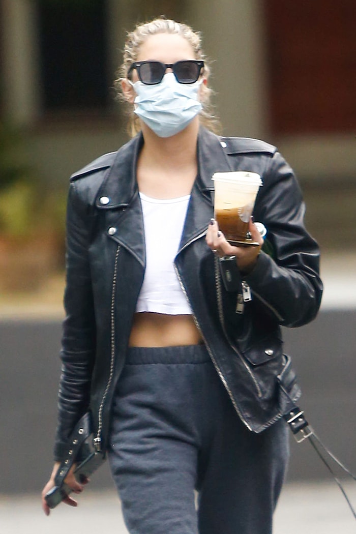 Ashley Benson keeps a low-key look with sunglasses and a face mask