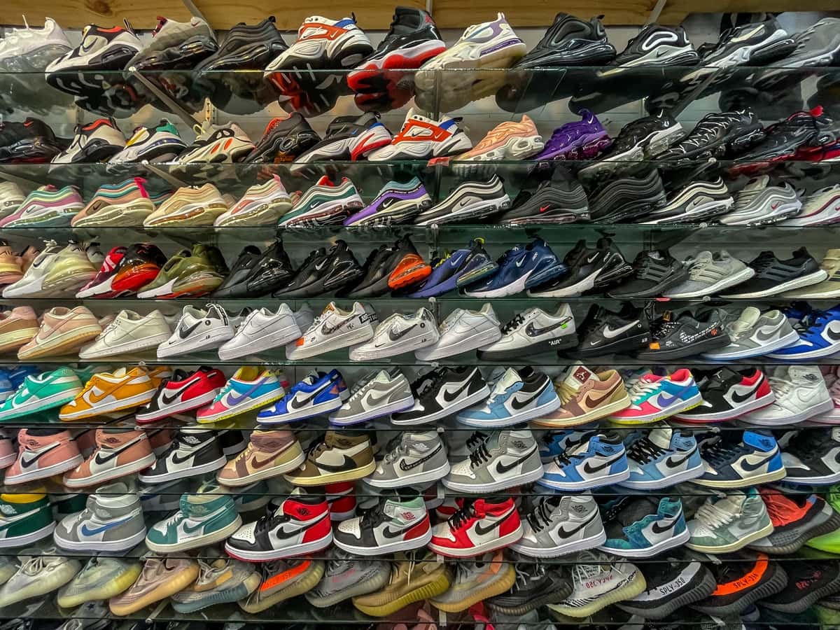 Counterfeit Nike Air Jordans and fake Adidas sneakers on display at a market in Thailand