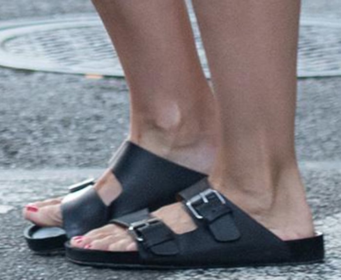 Katie Holmes slips her feet into a pair of Birkenstock Arizona premium sandals