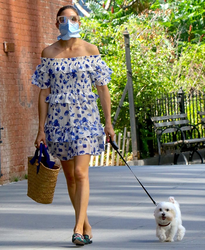 Olivia Palermo walks Mr. Butler in a summer floral dress in New York City