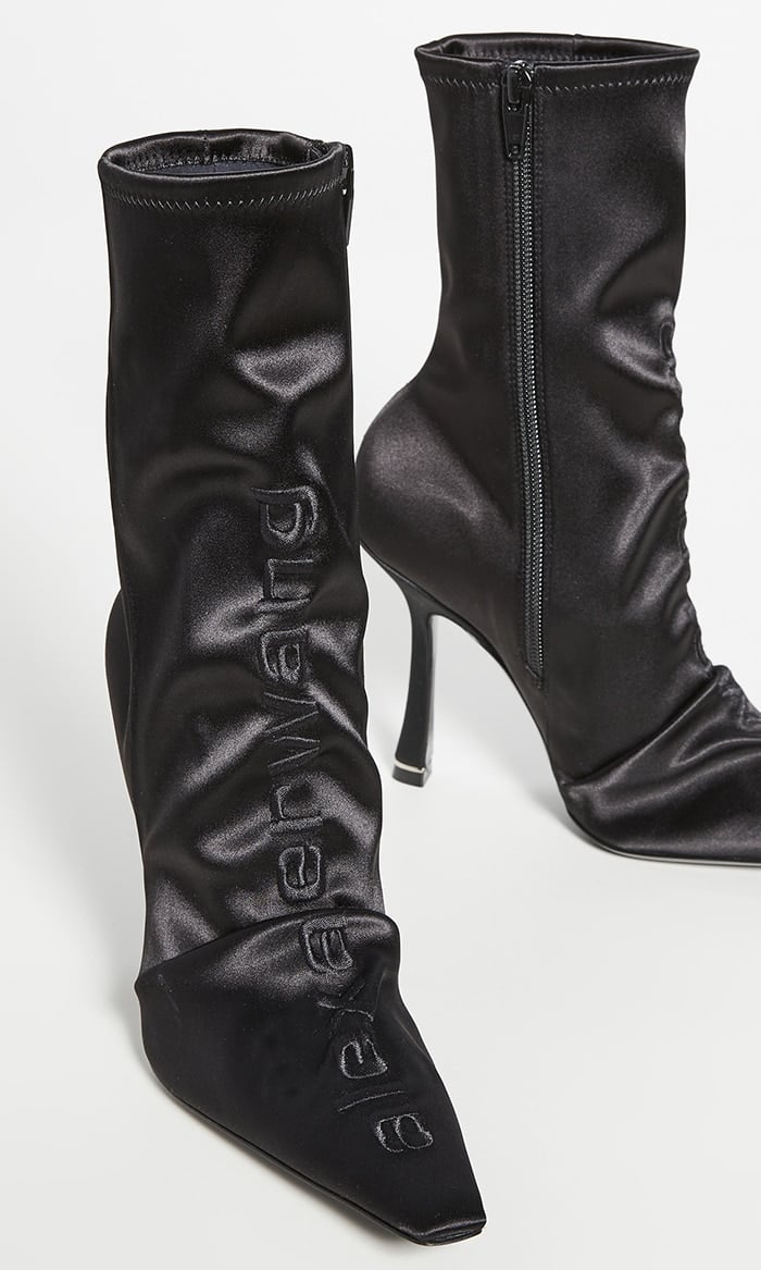 Black leather and satin Vanna pointed boots from Alexander Wang featuring a pointed toe, an ankle length and a mid-heel