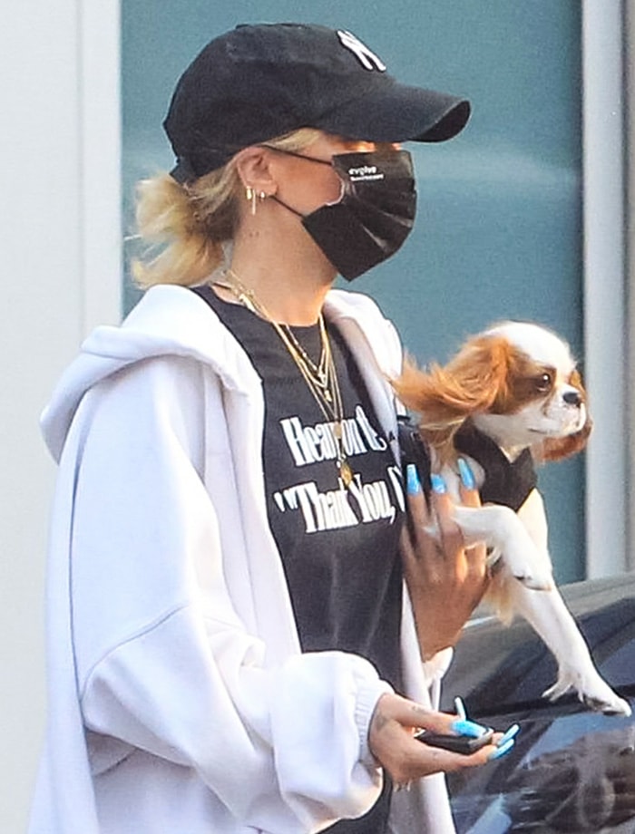 Ashley Benson styles her casual look with layered gold necklaces and earrings