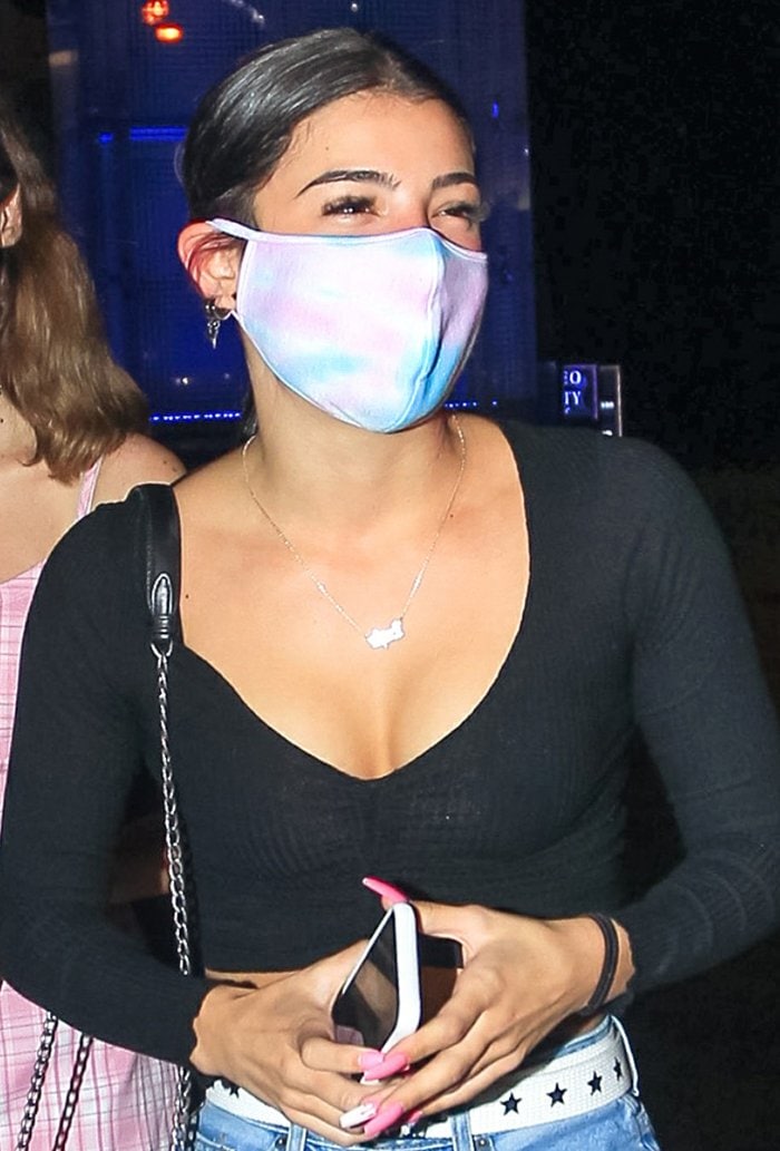 Charli D'Amelio wears a tie-dye-face mask for protection against coronavirus