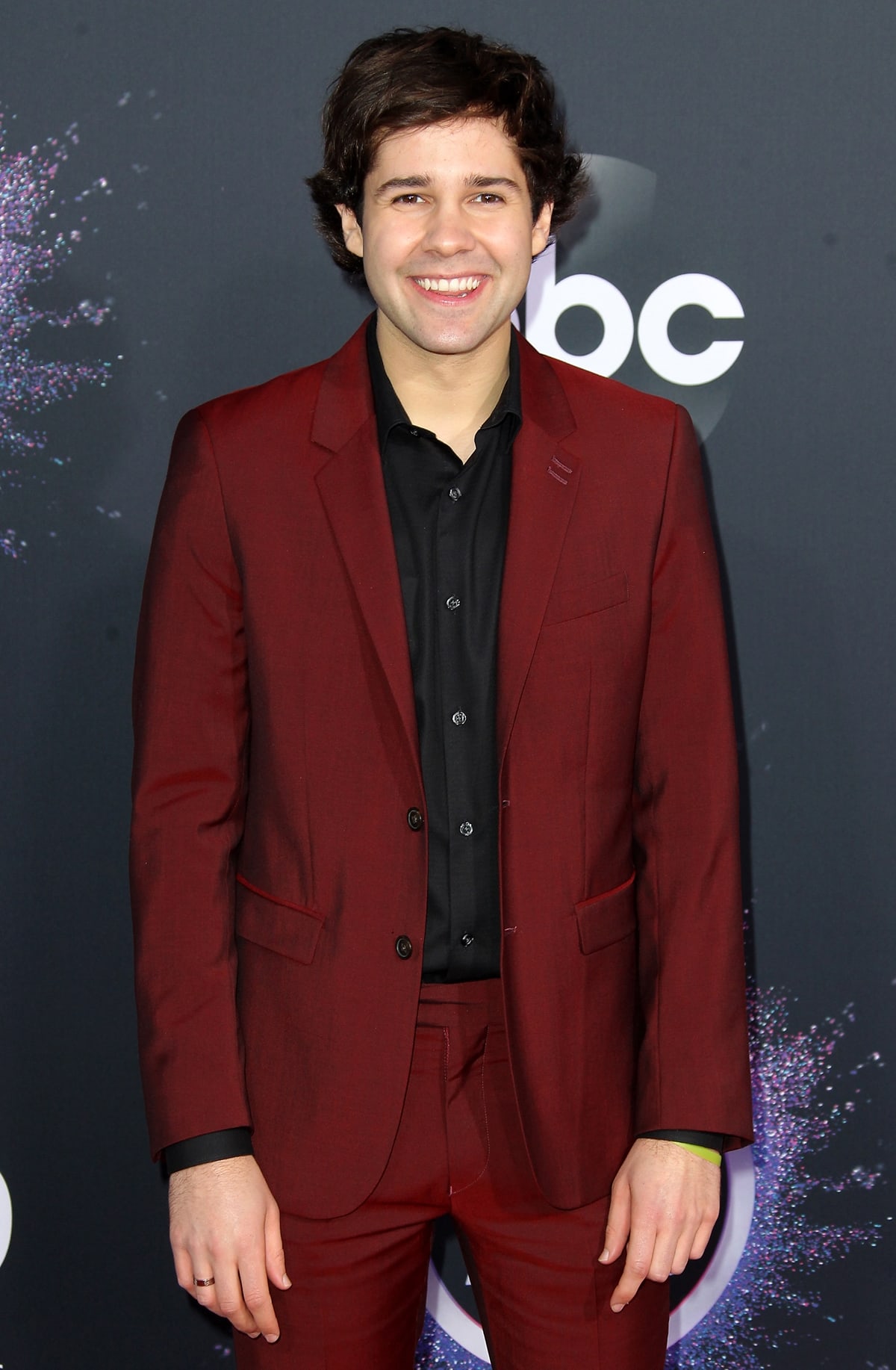 David Dobrik in a maroon suit at the 2019 American Music Awards