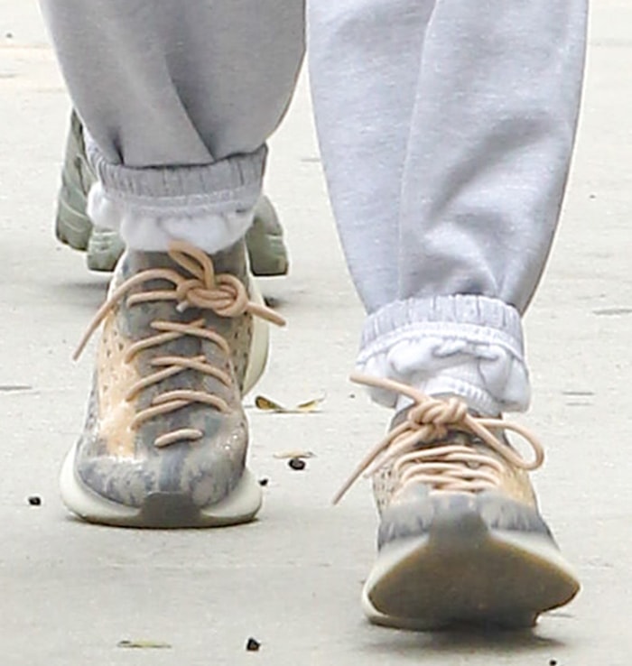 Hailey Bieber completes her look with Adidas Yeezy 380 sneakers