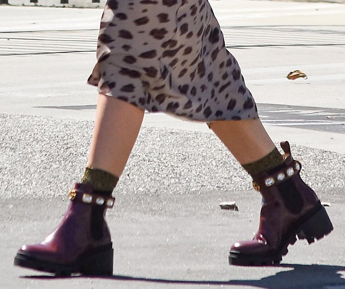 Hilary Duff slips into a pair of bejeweled Gucci boots