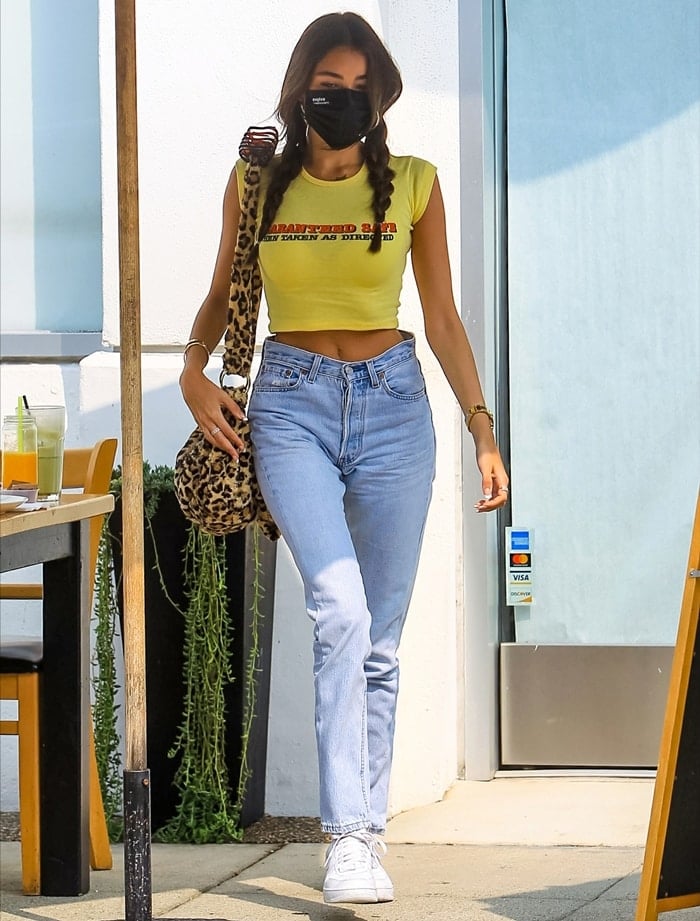 Madison Beer wears Shopexile's "Guaranteed Safe Take As Directed" T-shirt in West Hollywood