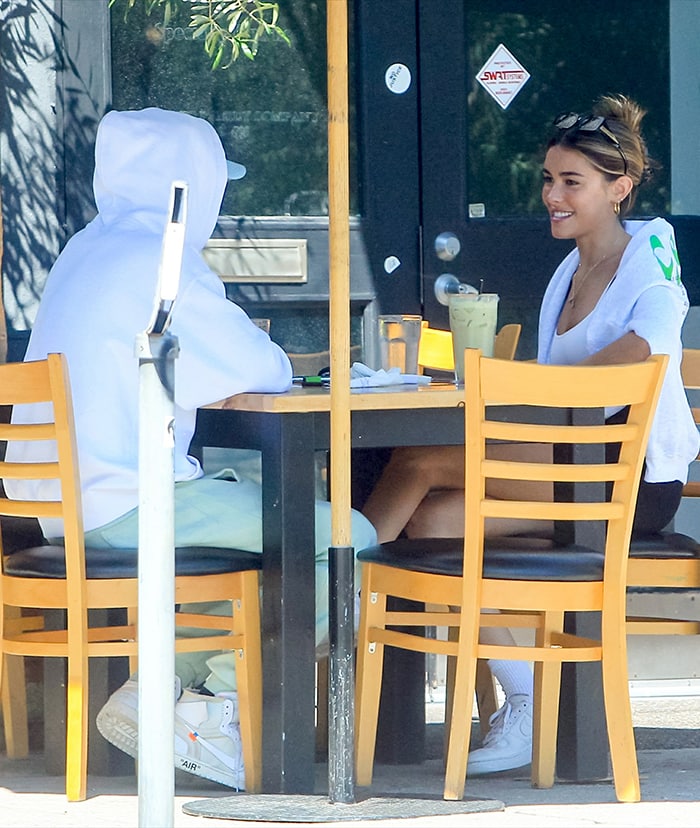 TikTok star Nick Austin in a white hoodie, mint green sweatpants, and Nike x Off White Air Jordan 1 sneakers