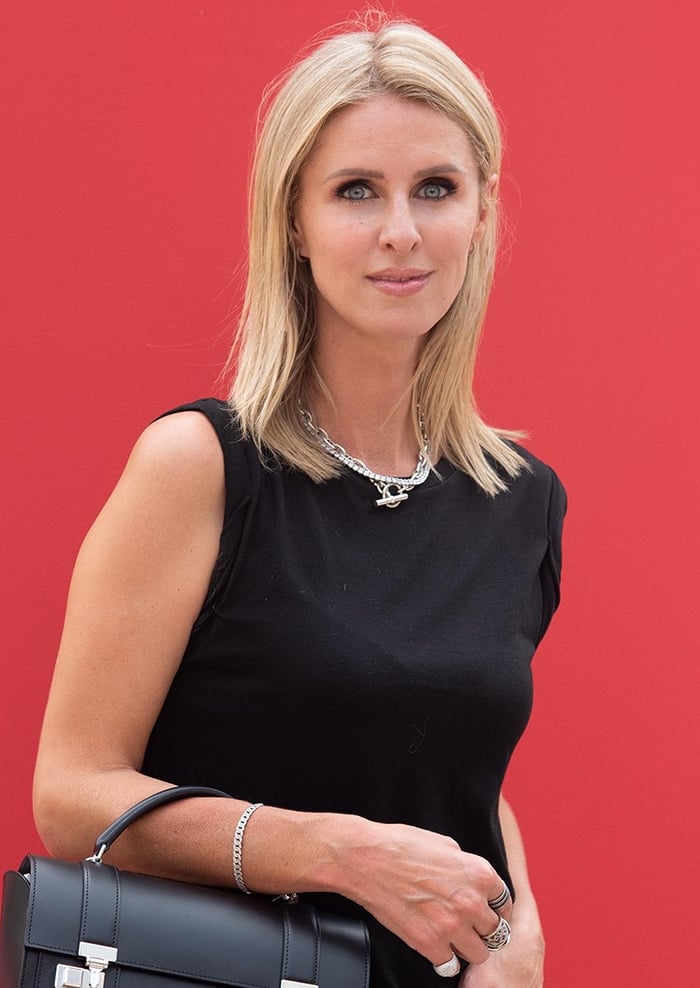 Nicky Hilton styles her blonde hair straight and glams up with smokey eyeshadow