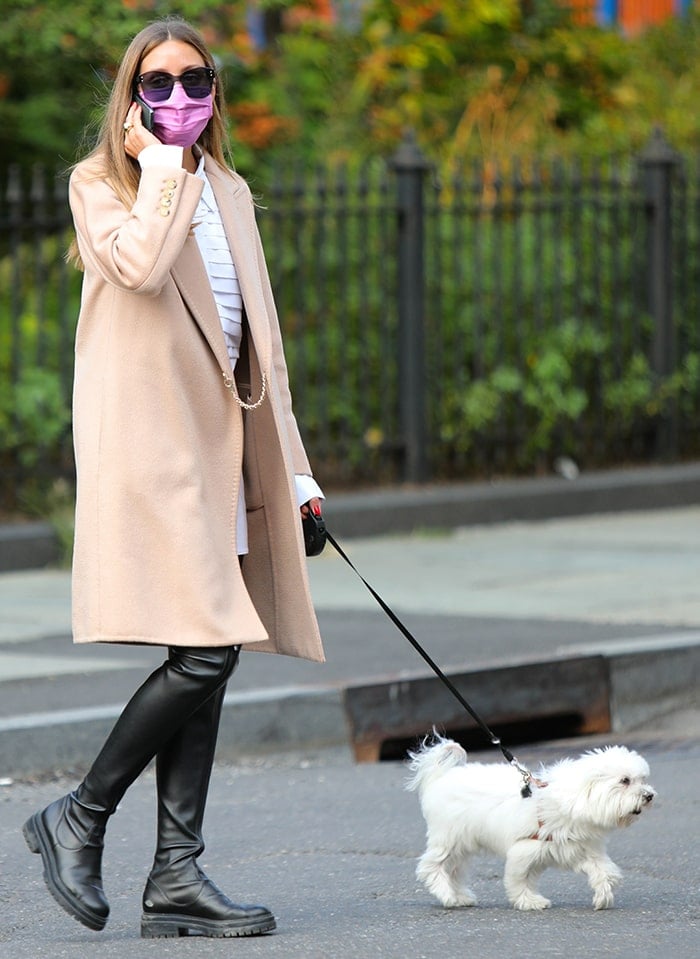 Olivia Palermo is ready for fall in her coat-and-boots combo as she walks her dog in Dumbo, Brooklyn on September 16, 2020