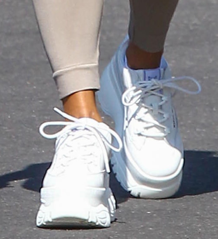 Vanessa Hudgens completes her dog walking outfit with Naked Wolfe shoes