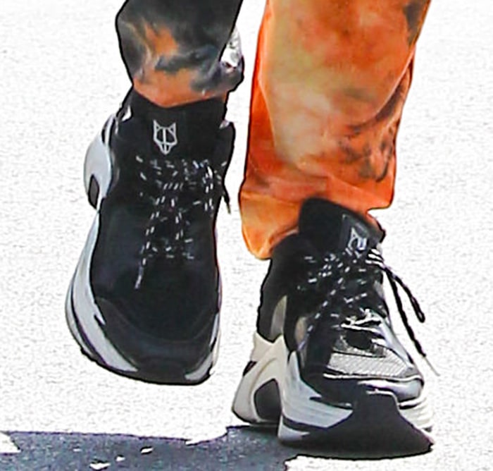 Vanessa Hudgens teams her trendy pants with Naked Wolfe Track chunky platform sneakers