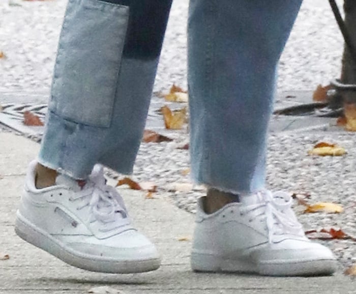 Camila Mendes slips into a pair of the iconic Reebok Club C sneakers