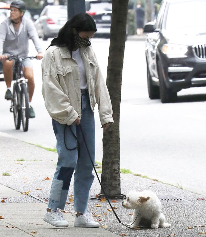 Camila Mendes takes her Maltipoo dog, Truffle, out for a walk in Vancouver, Canada on October 1, 2020