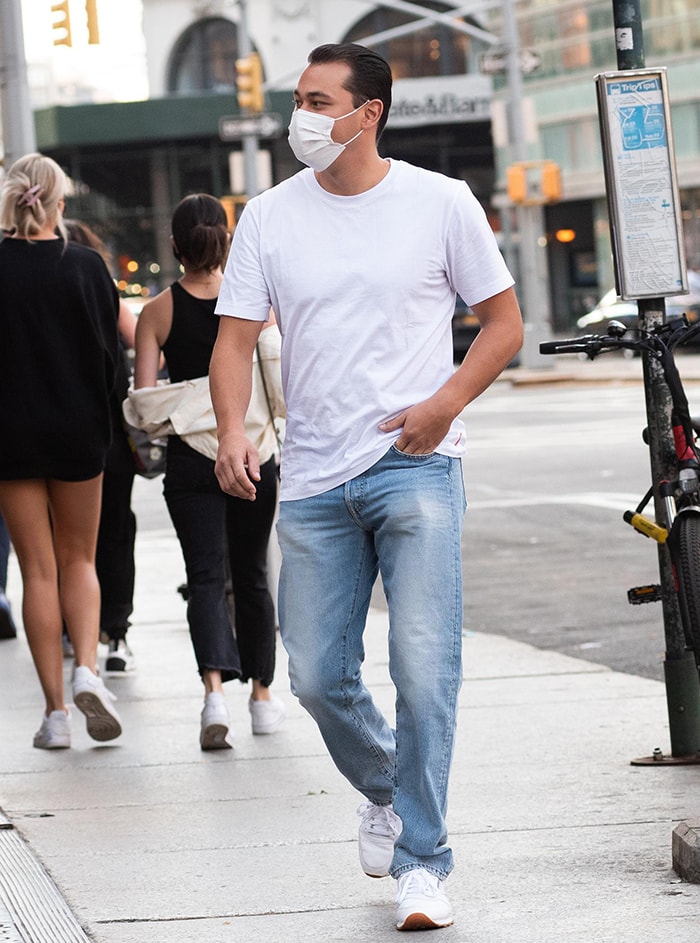 Emilio Vitolo Jr. looks fresh in a white tee, denim jeans, and white sneakers