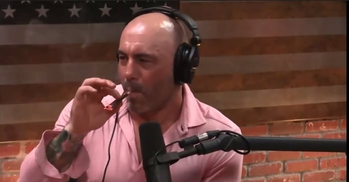 Joe Rogan smokes a marijuana joint while recording the 'Joe Rogan Experience' podcast