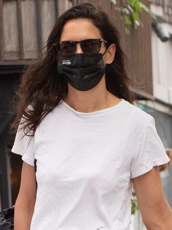 Katie Holmes wears her hair loose and keeps a low-key look with sunglasses and face mask