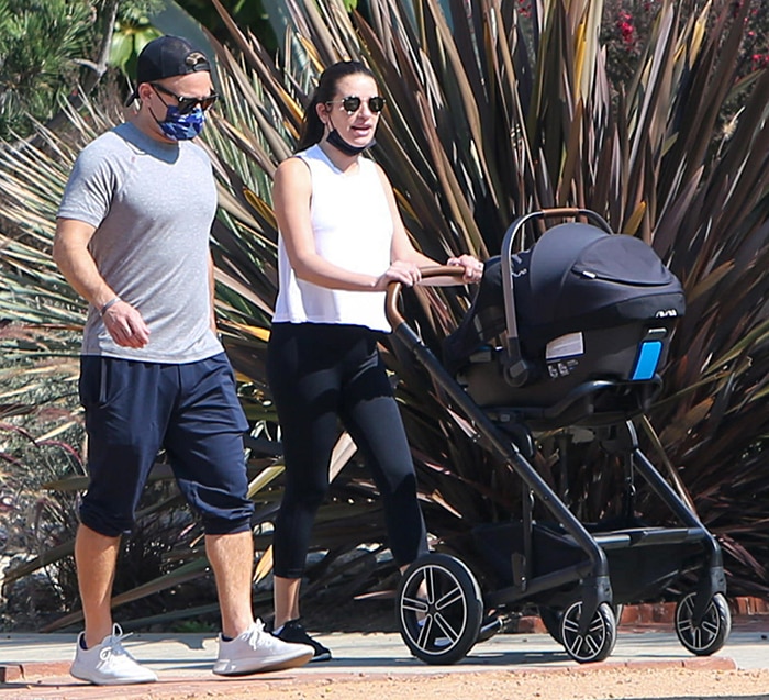 Zandy Reich wears a gray tee with cropped sweats while Lea dons a monochrome athleisure