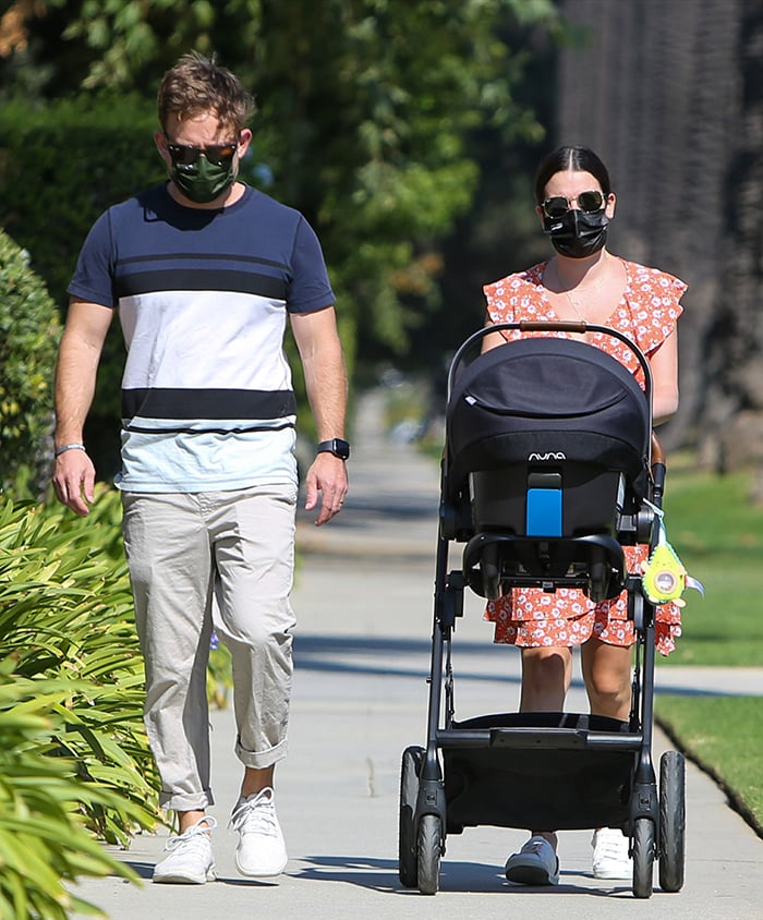 Lea Michele looks summer chic in an orange floral dress