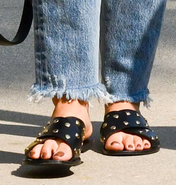 Lucy Hale shows off her feet in Anine Bing slide sandals