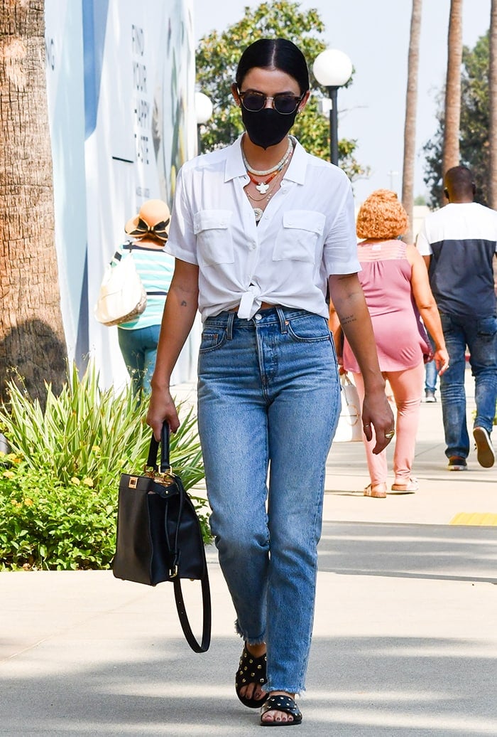 Lucy Hale opts for a summery chic white shirt with denim jeans