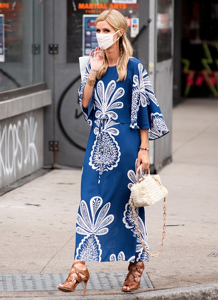 Nicky Hilton cuts a chic figure in a blue and white La DoubleJ maxi dress with pineapple print painted by artist Kirsten Synge