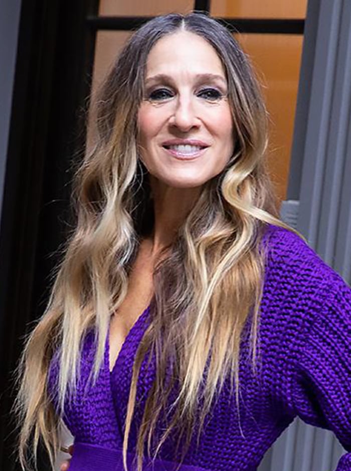 Sarah Jessica Parker wears her naturally curly hair down with her signature smokey eye-makeup