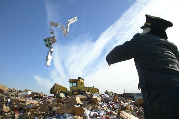 Thousands of counterfeit products are destroyed by customs officials in China after being confiscated from shops