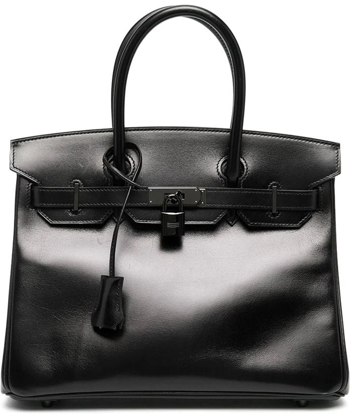 Constructed from so black leather, this Birkin tote bag from Hermès will steal your spotlight fairly easily - don't worry, you'll still be happy to carry everything you want inside it