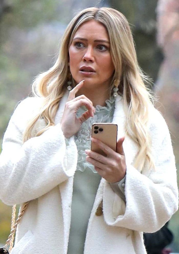 Hilary Duff wears glammed up makeup with tousled long blonde hair