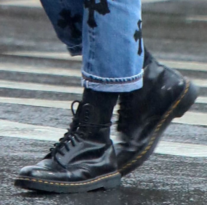 Irina Shayk completes her rainy day look with Dr. Martens 1460 boots