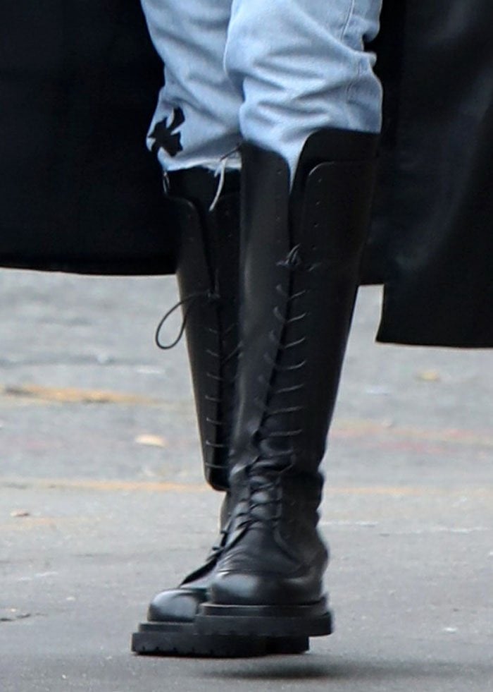 Irina Shayk completed her grungy, androgynous look with Magda Butrym knee-high boots