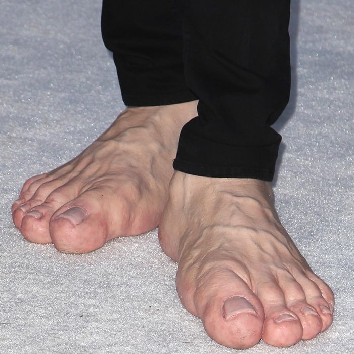 Jim Carrey wears enormous prosthetic feet to Elton John's 2013 AIDS Foundation Academy Awards Viewing Party