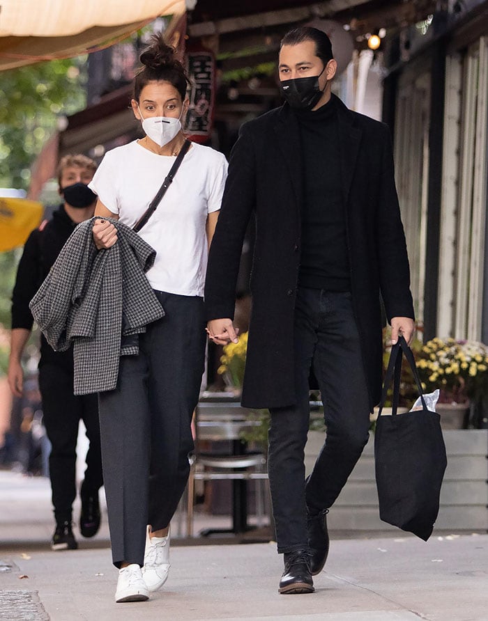 Emilio Vitolo Jr. is dapper with a slicked-back hairstyle and an all-black outfit