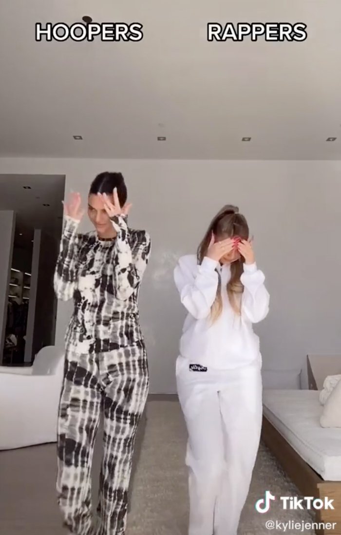 Kendall and Kylie Jenner cover their faces as they choose their preference in men in a TikTok video