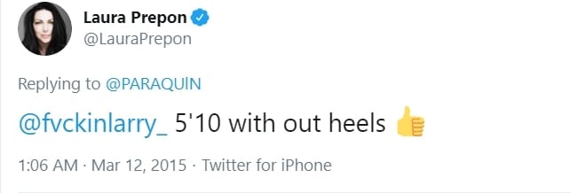 Laura Prepon confidently confirms her height as 5'10" (178 cm) without heels in this tweet, embracing her statuesque frame with a thumbs-up