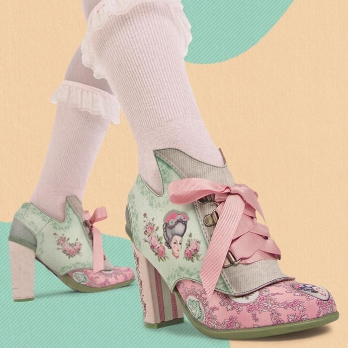 These pink heels feature a cameo brooch of the iconic queen, ribbons, flowers, cakes, Marie Antoinette’s birth and death dates, and even a guillotine