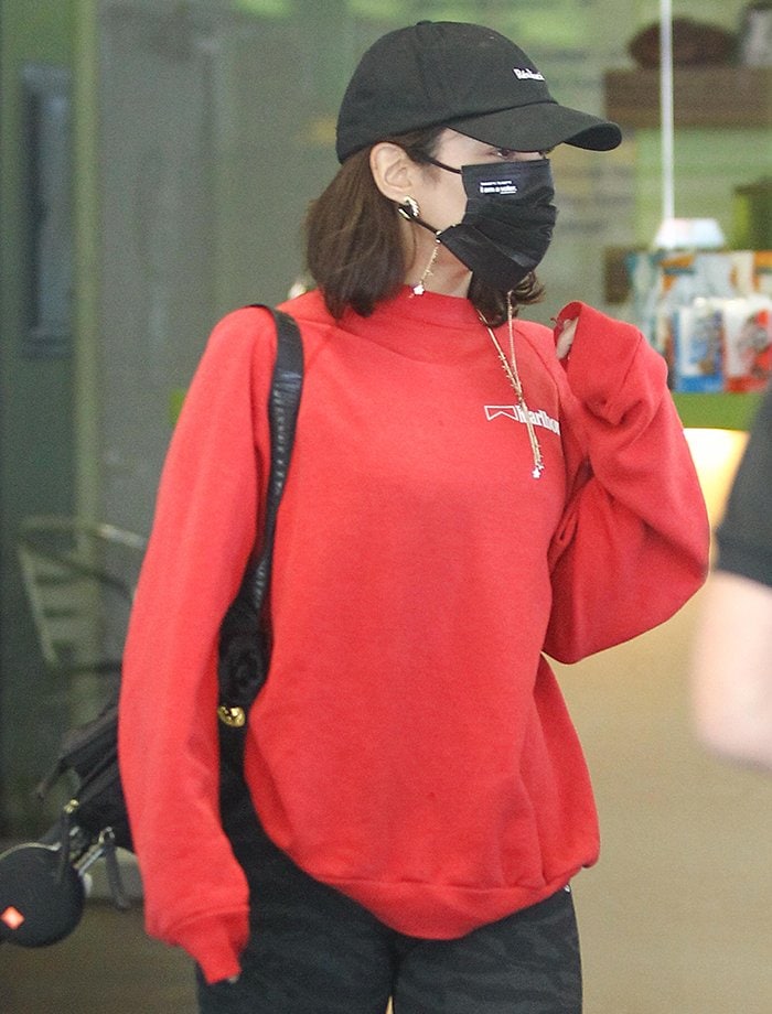 Vanessa Hudgens keeps things low-key in a Realisation cap and black face mask