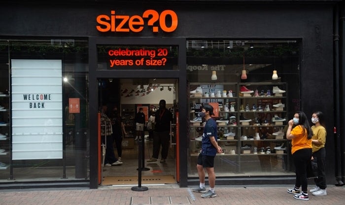 People queueing up outside of the Size? shoe store in Carnaby Street, London, England