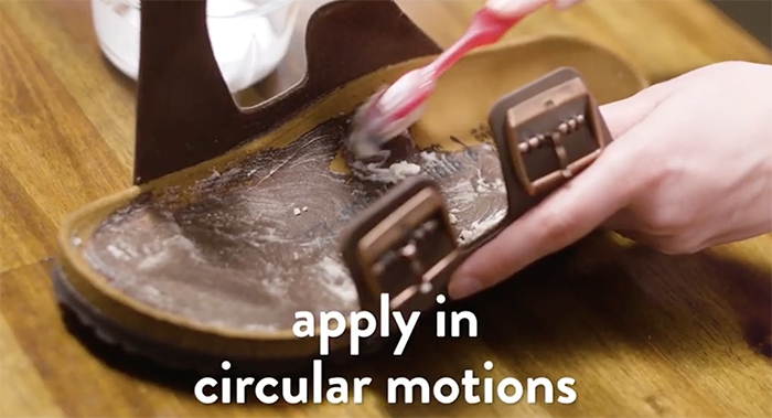 Using an old toothbrush to clean your Birkenstock sandals