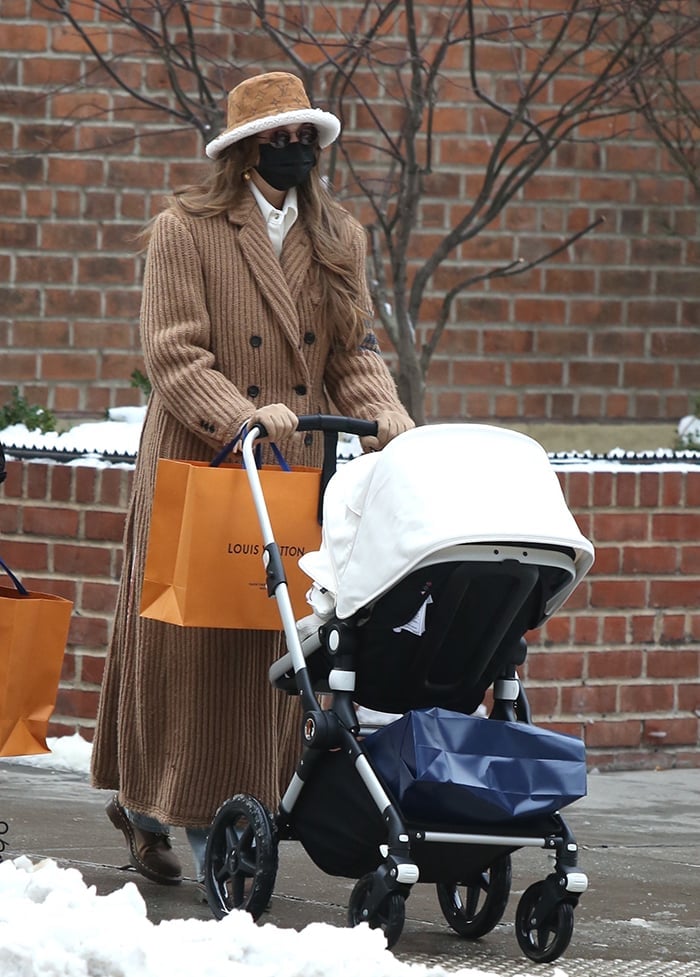 Gigi Hadid turns heads in a stylish Thom Browne tan ribbed coat