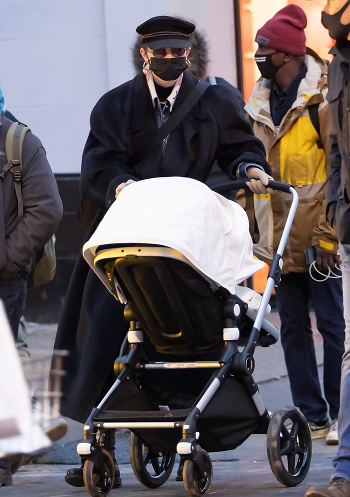 Gigi Hadid bundles up in a shearling coat on a stroll with her baby girl