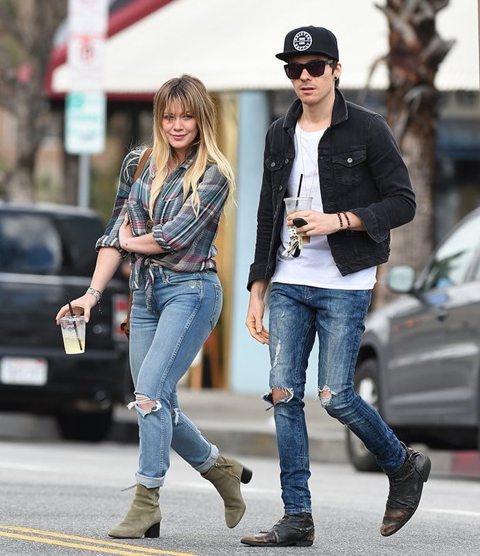 Hilary Duff and then-rumored boyfriend Matthew Koma step out in stylish casuals in Los Angeles on January 19, 2017, sporting coordinated laid-back looks with ripped jeans and trendy boots