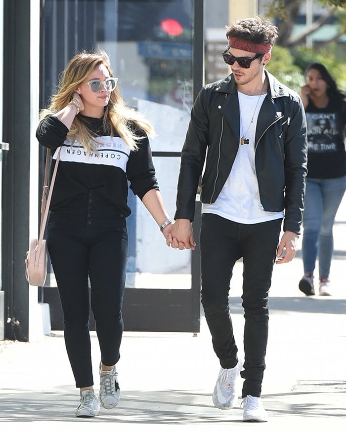 Hilary Duff and Matthew Koma walk hand-in-hand in Los Angeles on October 15, 2017, shortly after rekindling their romance
